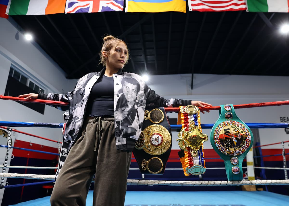 Seniesa Estrada with championship belts