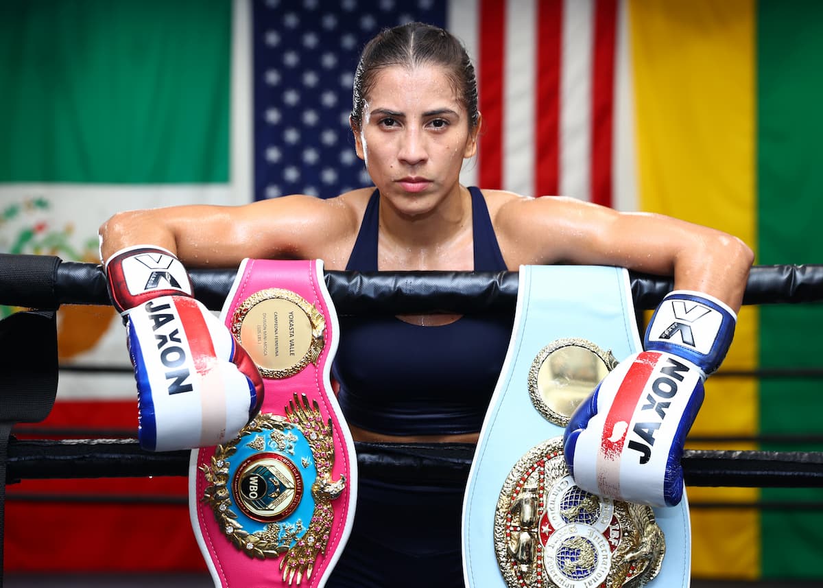 Seniesa Estrada with her IBF and WBO title belts