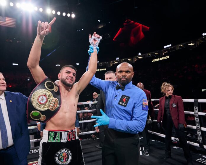 Referee Robert Hoyle raises Jesus Ramos' hand in victory over Jeison Rosario
