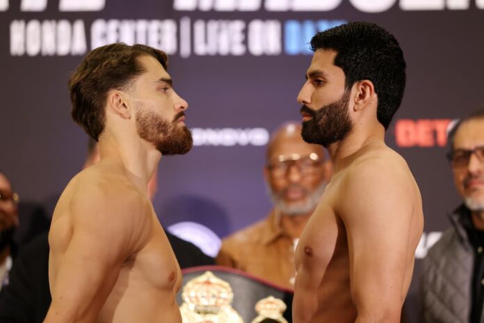 Oscar Duarte and Miguel Madueno face each other at the weigh-in ahead of their boxing bout