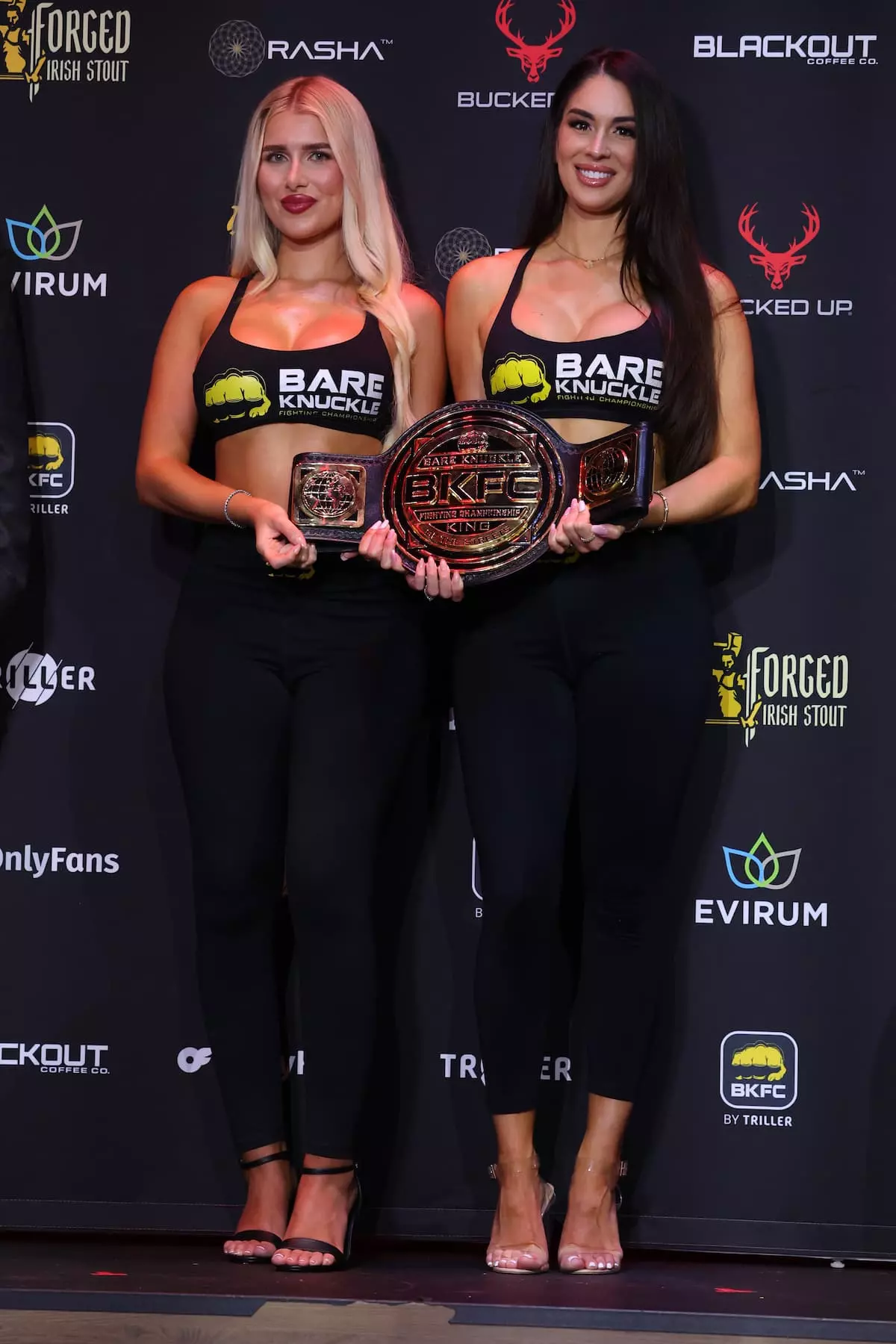 BKFC ring girls present the championship belt