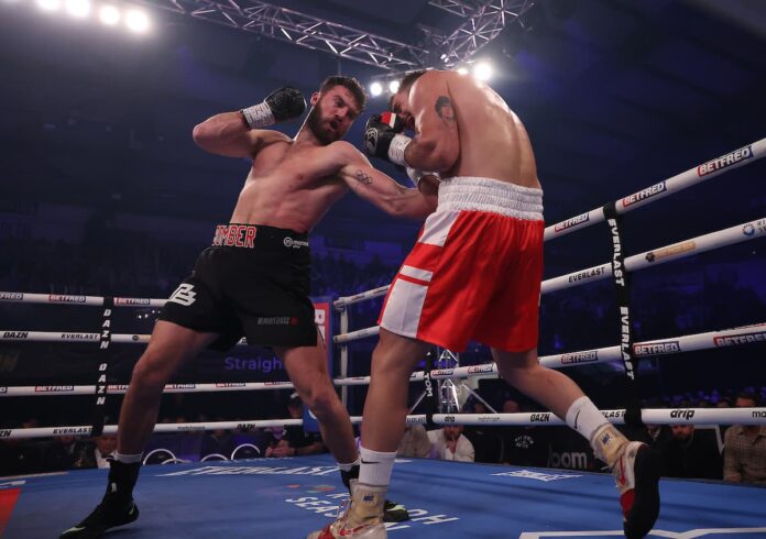Pat Brown punches Federico Javier Grandone during their boxing bout