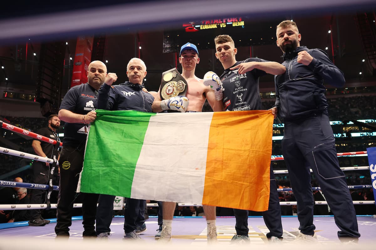 Aaron McKenna with his team after his victory over Liam Smith