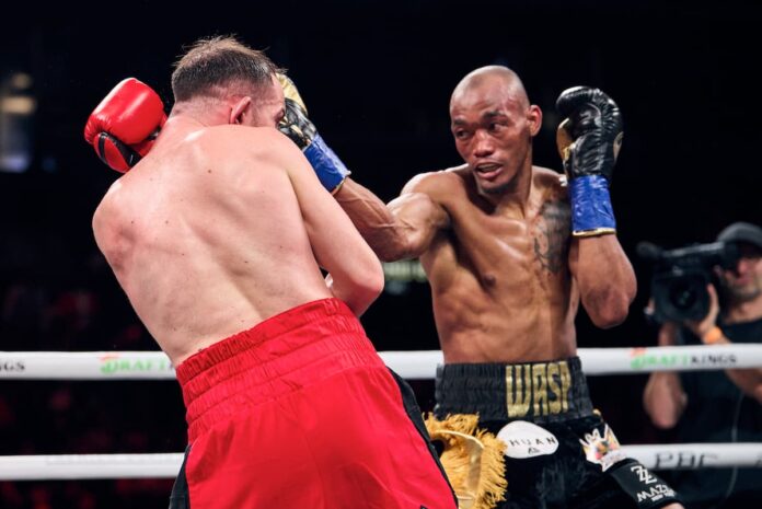 Alberto Puello punches Sandor Martin during their boxing bout