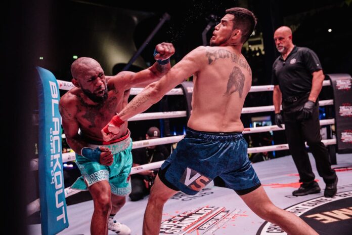 Austin Trout throws a punch during his bare-knuckle boxing bout against Carlos Trinidad-Snake at BKFC 71 in Dubai