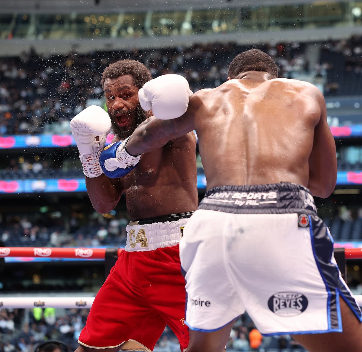 Cheavon Clarke punches Viddal Riley during their boxing bout