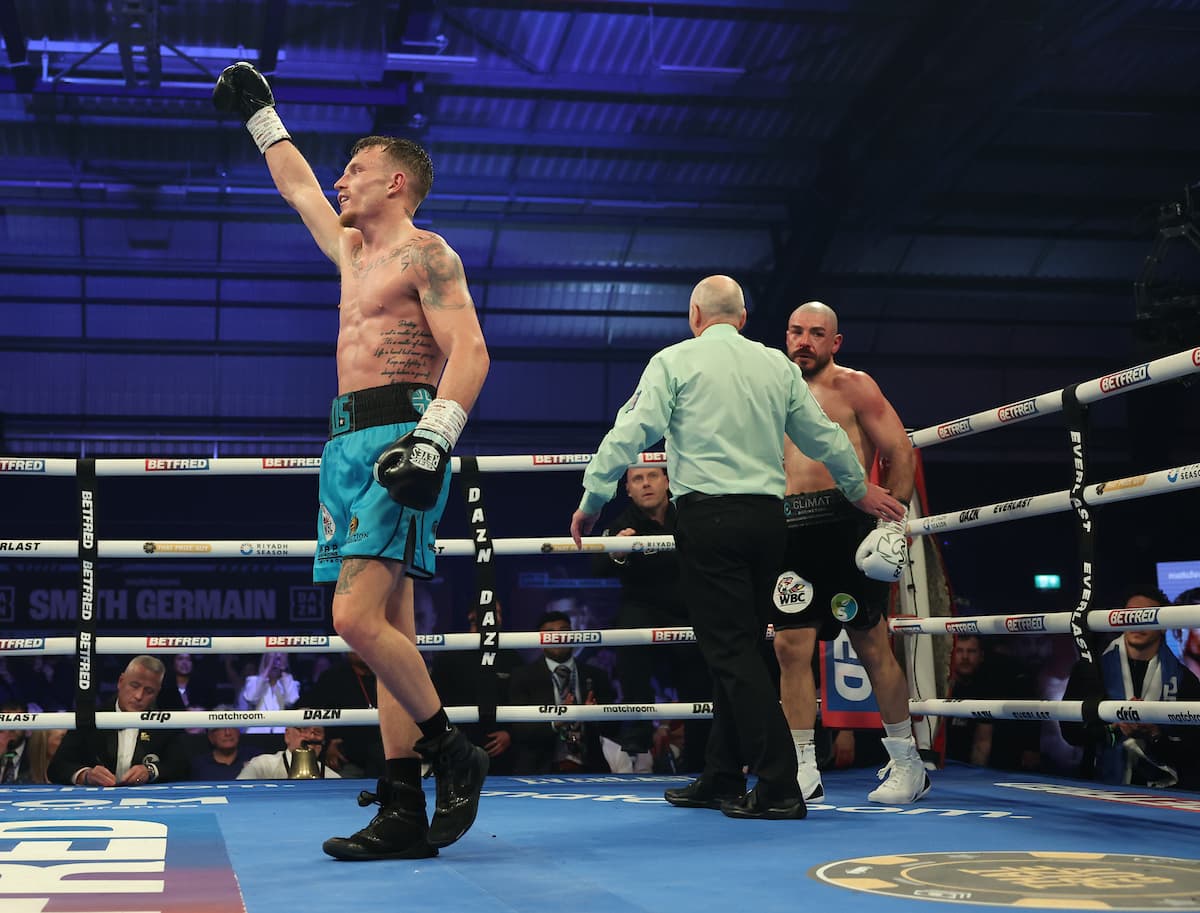 Dalton Smith raises his hand celebrating victory over Mathieu Germain