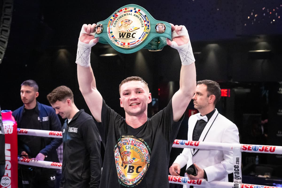 Dzmitry Asanau poses with his WBC belt after his boxing bout against Francesco Patera
