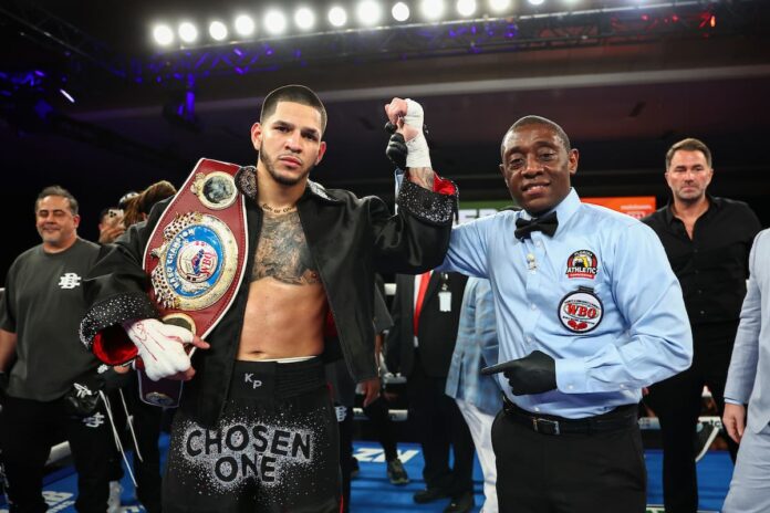 Referee Chris Young raises Edgar Berlanga's hand in victory over Jonathan Gonzalez Ortiz