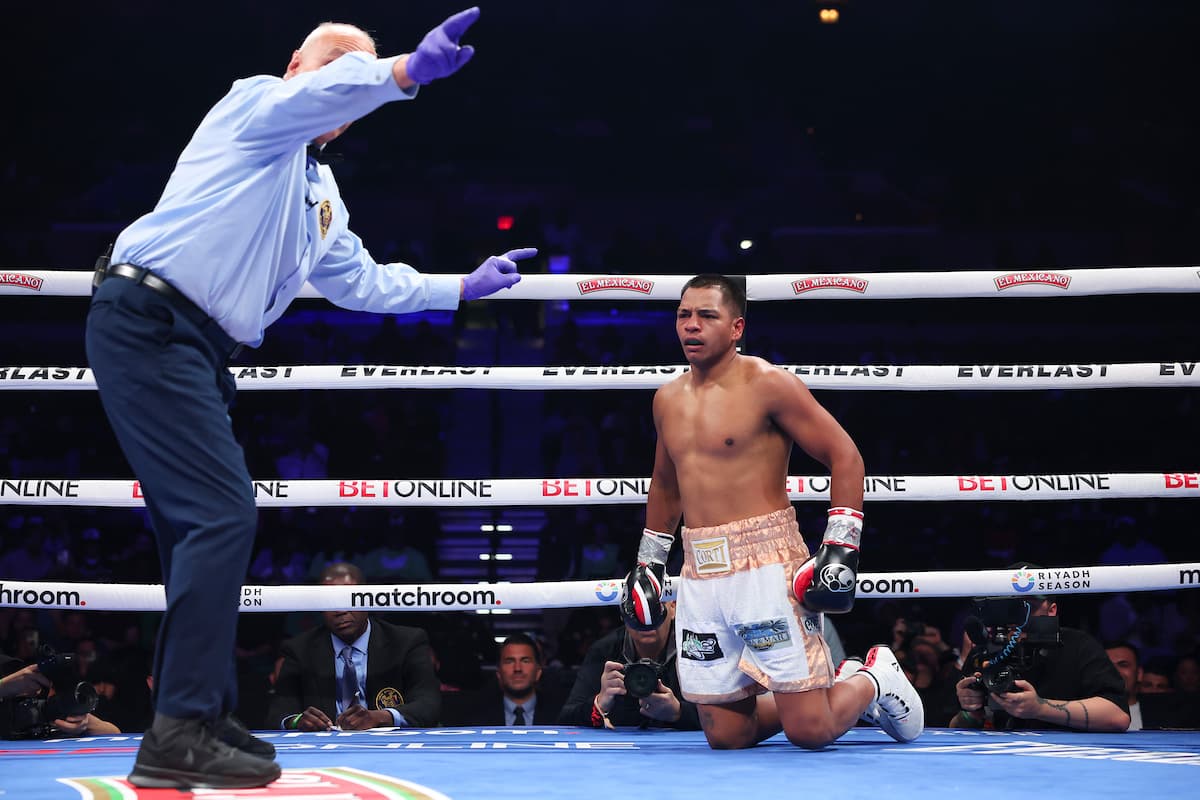 Franco Maximiliano Ocampo suffers a knockdown in his boxing bout against Shakhram Giyasov