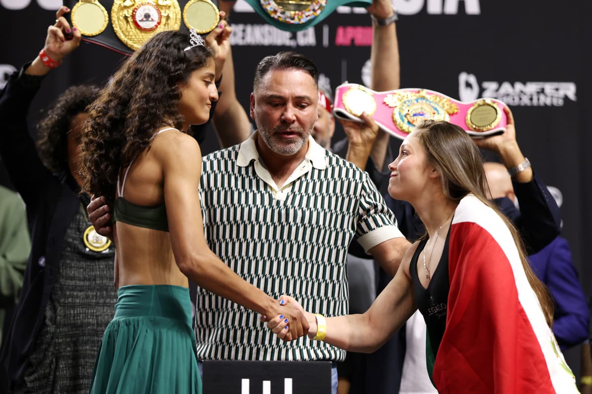 Gabriela Fundora and Marilyn Badillo shake hands at the weigh-in ahead of their boxing bout