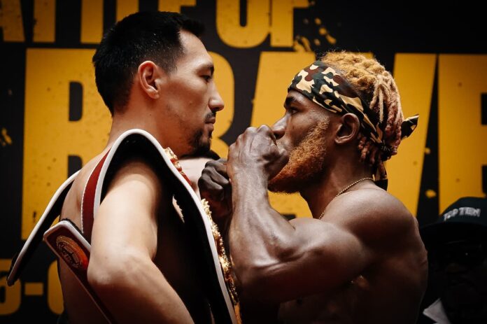 Janibek Alimkhanuly and Anauel Ngamissengue face off at the weigh-in before their boxing bout in Astana, Kazakhstan