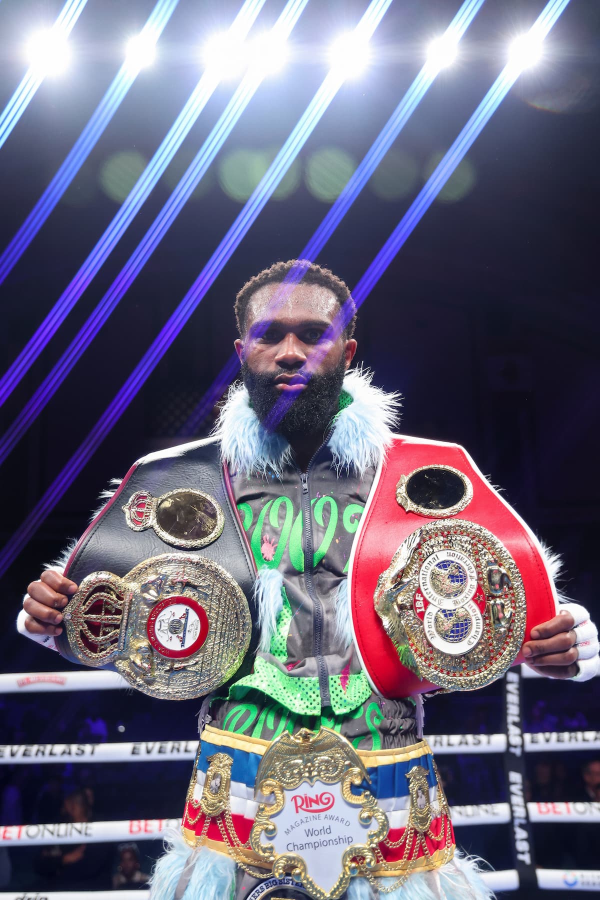 Jaron Ennis poses with his championship belts after his victory over Eimantas Stanionis