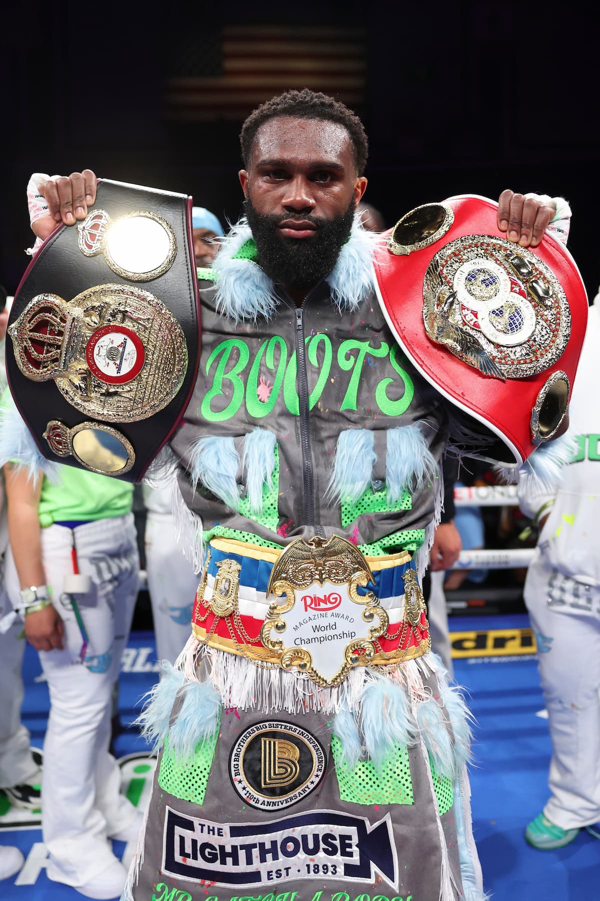 Jaron Ennis poses with his championship belts after his victory over Eimantas Stanionis