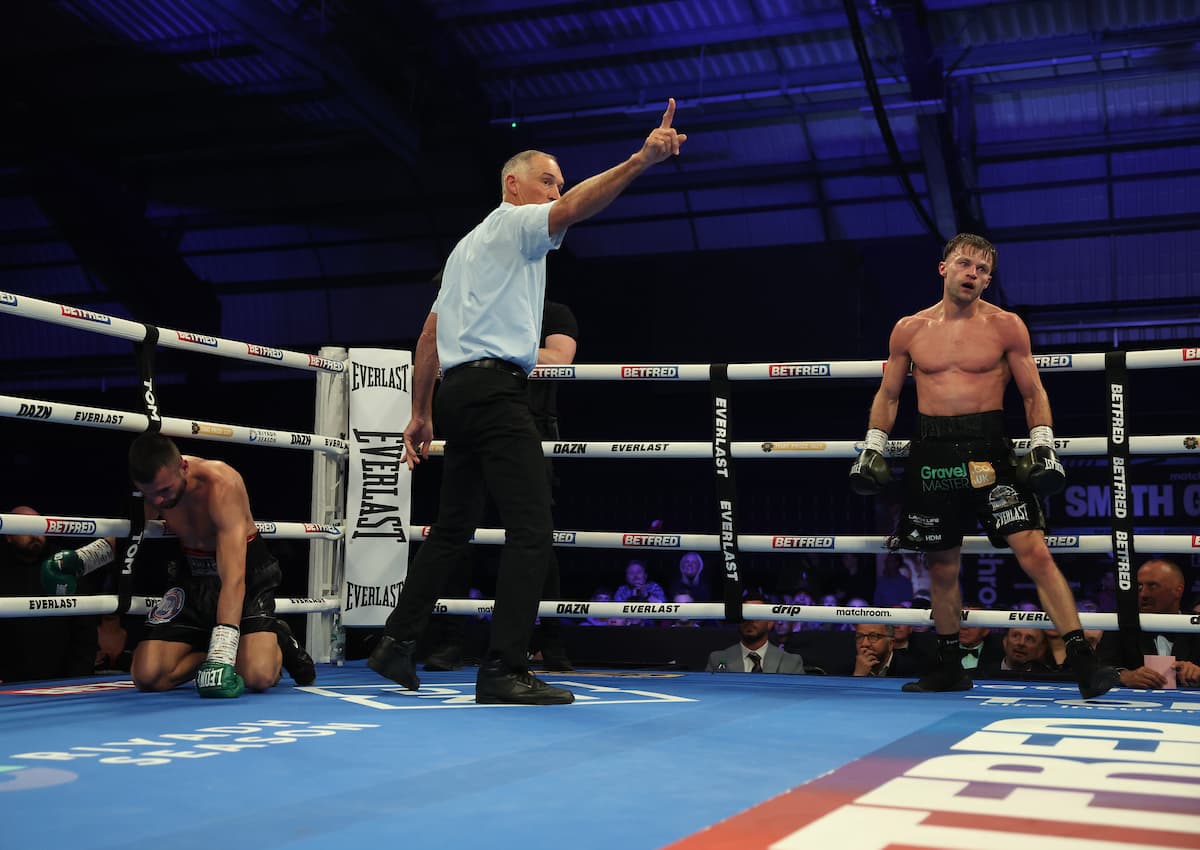 Josh Padley knocks down Marko Cvetanovic during their boxing bout