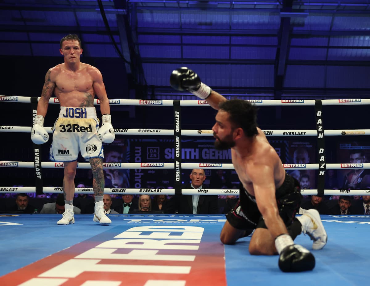 Josh Warrington knocks down Asad Asif Khan during their boxing bout