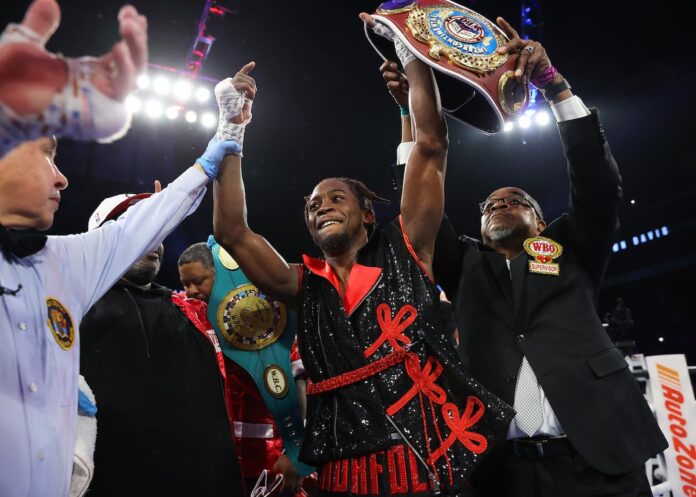 Keyshawn Davis celebrates victory in his boxing bout against Anthony Yigit in Newark