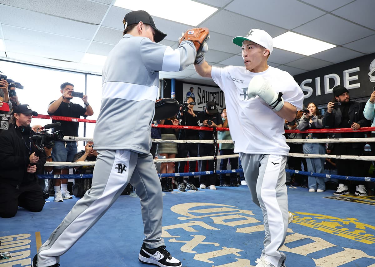 Naoya Inoue punches mitts during a media workout