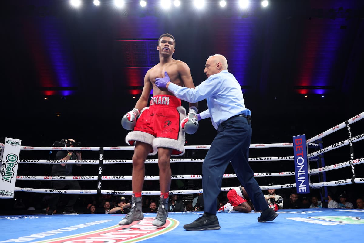 Omari Jones knocks down William Jackson during their boxing bout