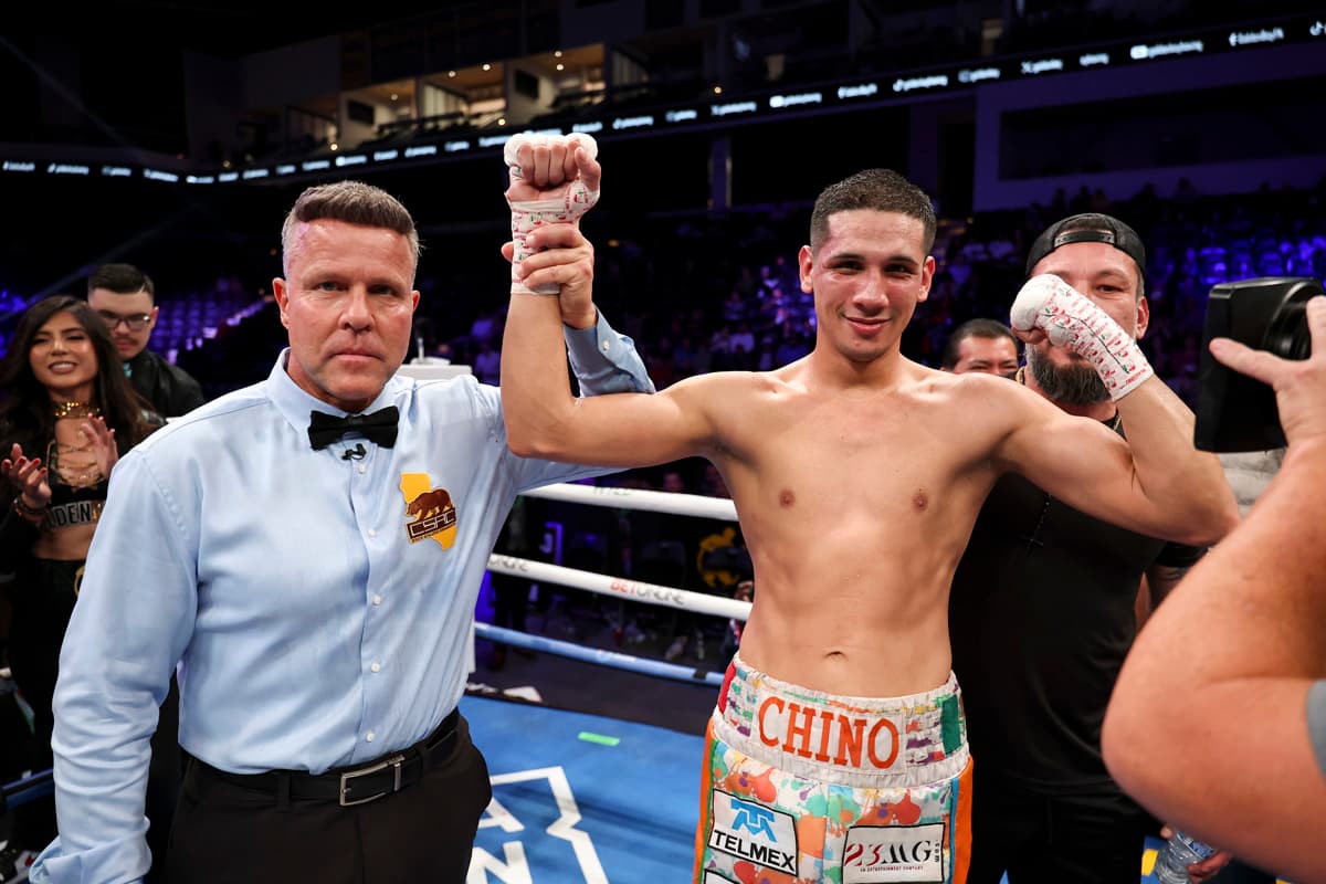 Referee Thomas Taylor raises Jorge Garcia Perez’s hand after his victory over Charles Conwell