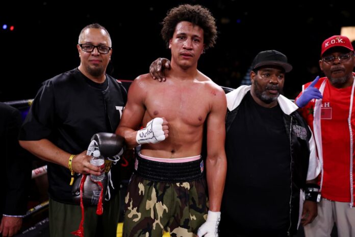 Tristan Kalkreuth with his team after his victory over Anthony Hollaway in a boxing match