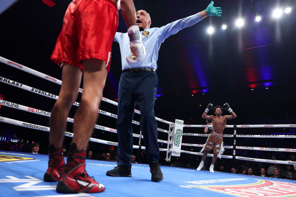 Zaquin Moses celebrates victory over Alex Pallette, while the referee waves the fight off