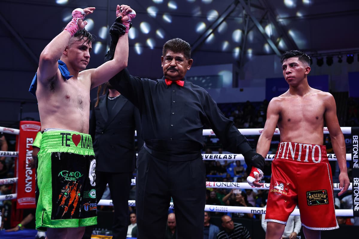 Adrian Curiel has his hand raised after defeating Johan Rubio during their boxing match in Guadalajara, Jalisco, Mexico