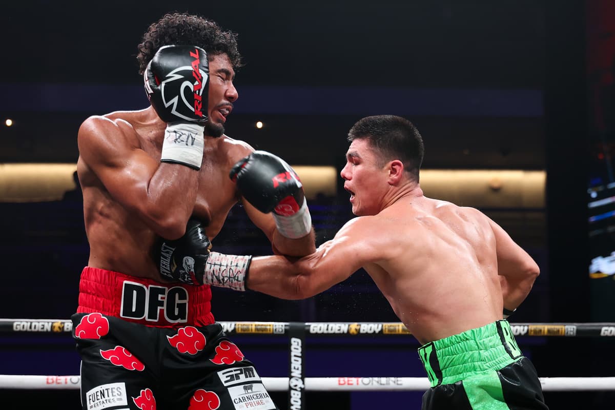Bektemir Melikuziev punches Darius Fulghum during their bout in Las Vegas