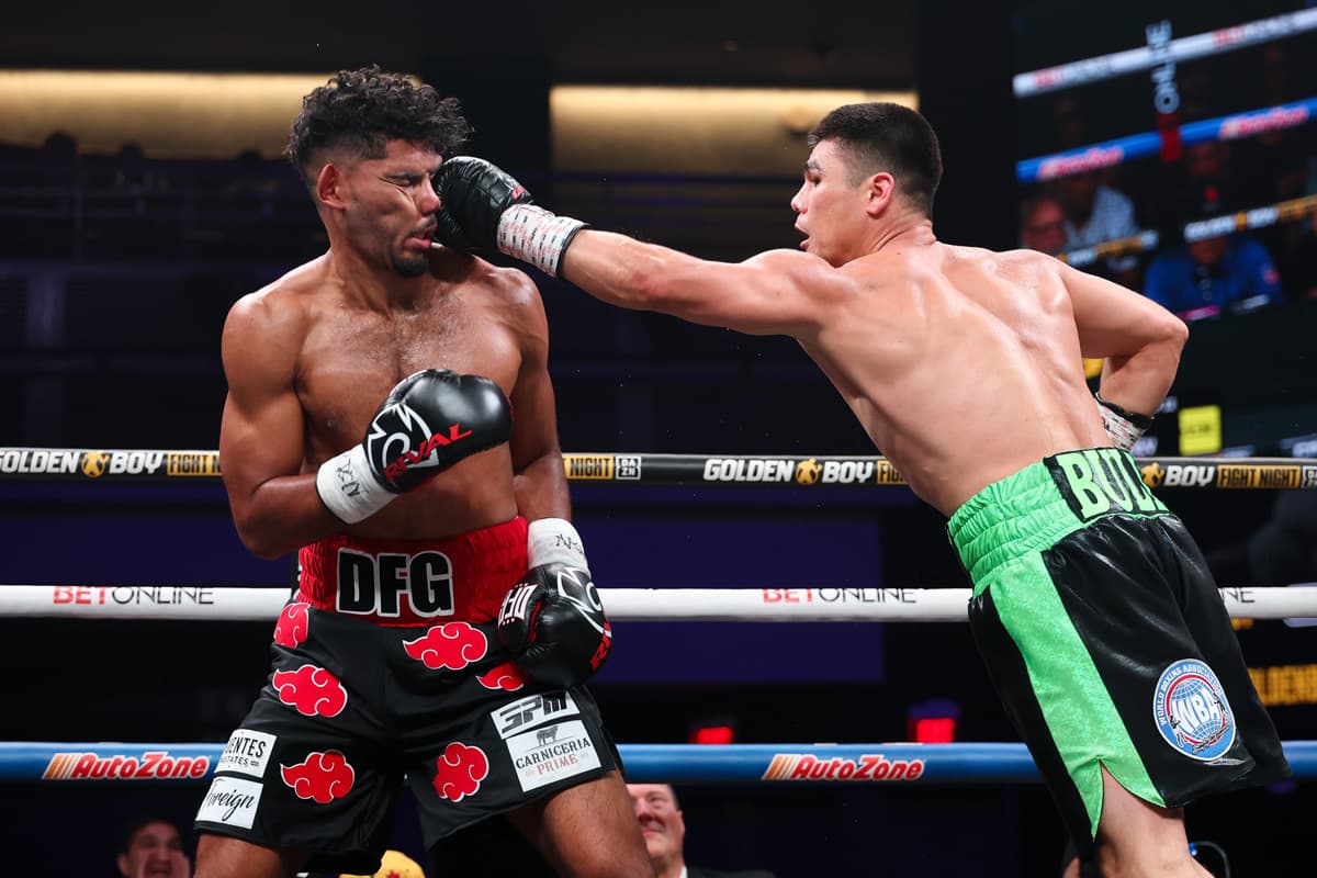 Bektemir Melikuziev punches Darius Fulghum during their boxing bout in Las Vegas