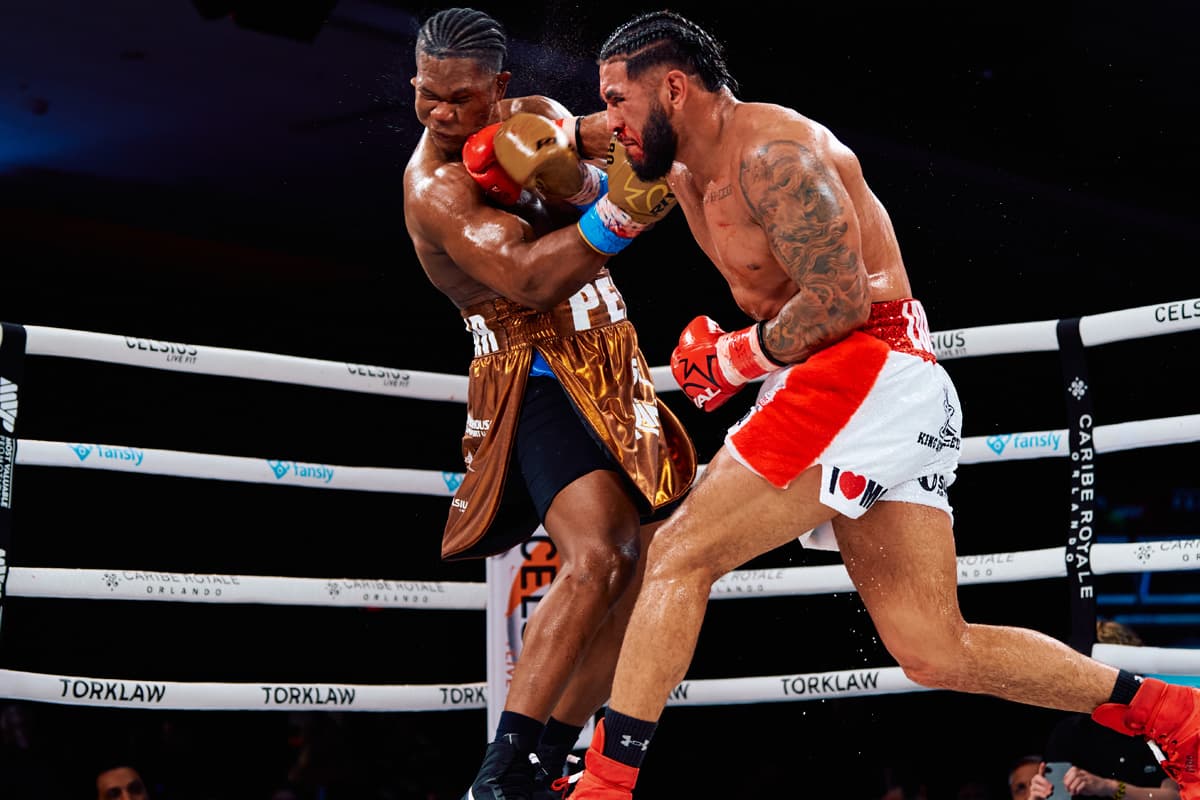 Cesar Navarro punches Dainier Pero during their bout at Most Valuable Prospects 12 in Orlando, Florida