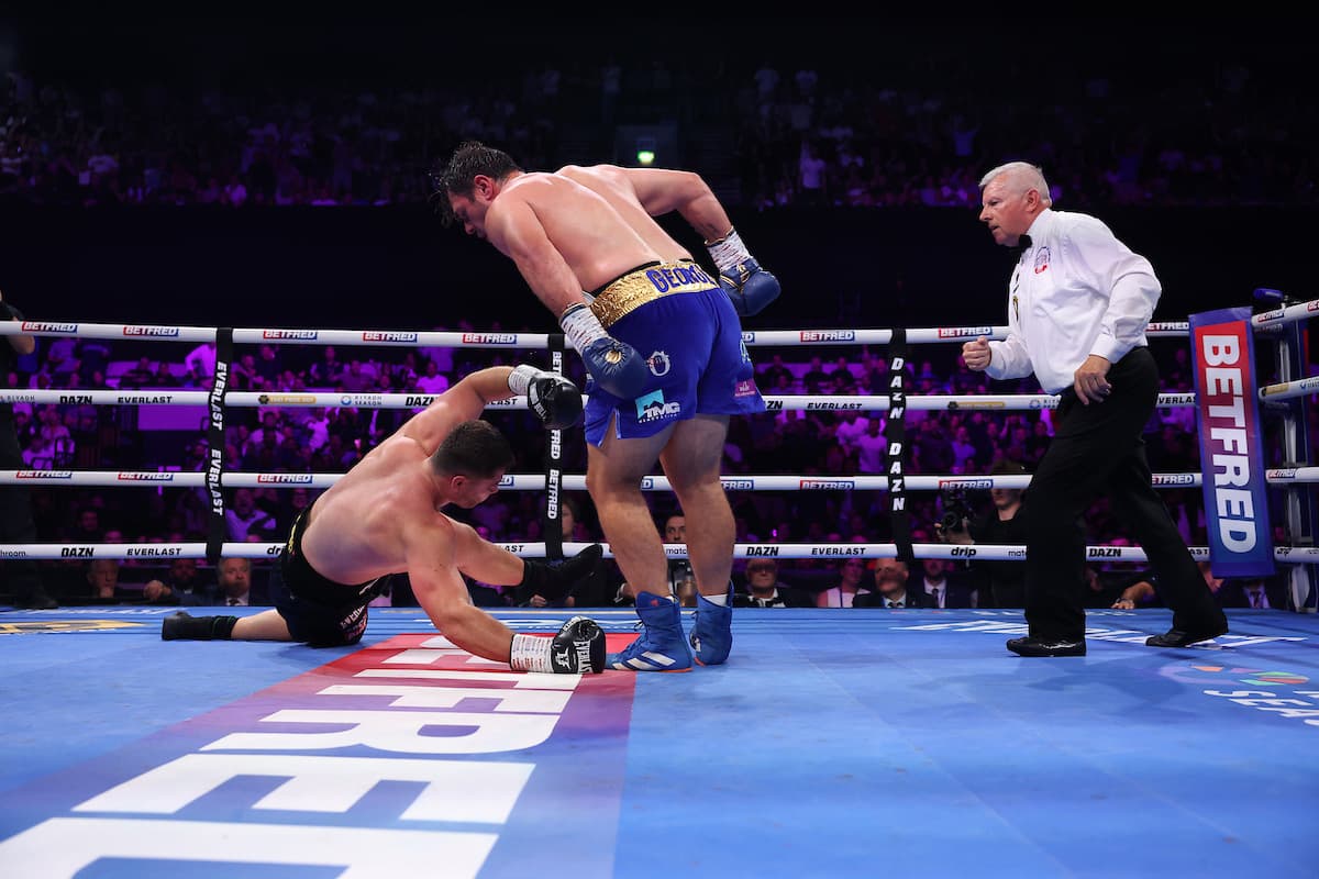 David Allen knocks down Johnny Fisher during their boxing rematch in London
