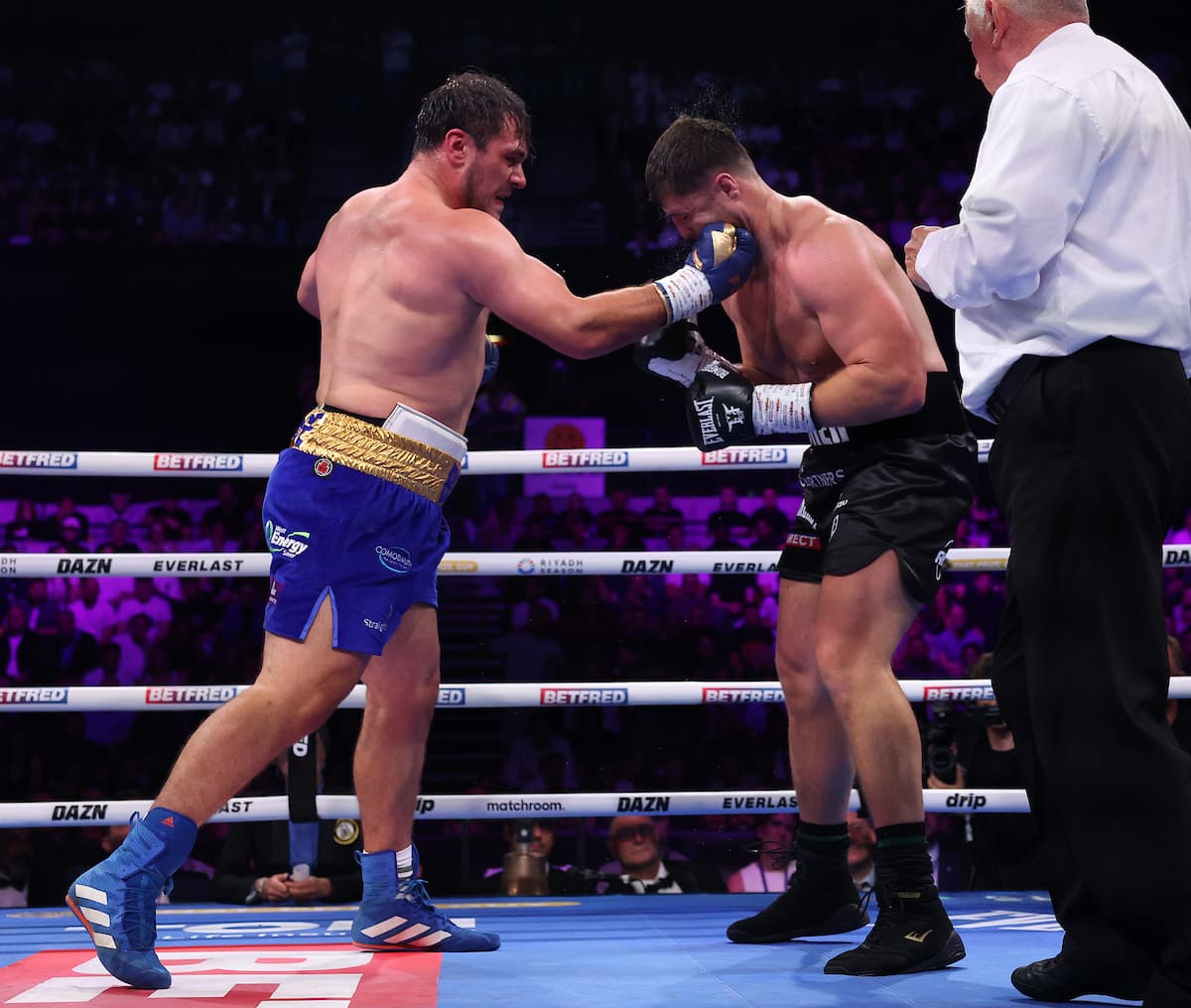David Allen punches Johnny Fisher during their boxing rematch in London