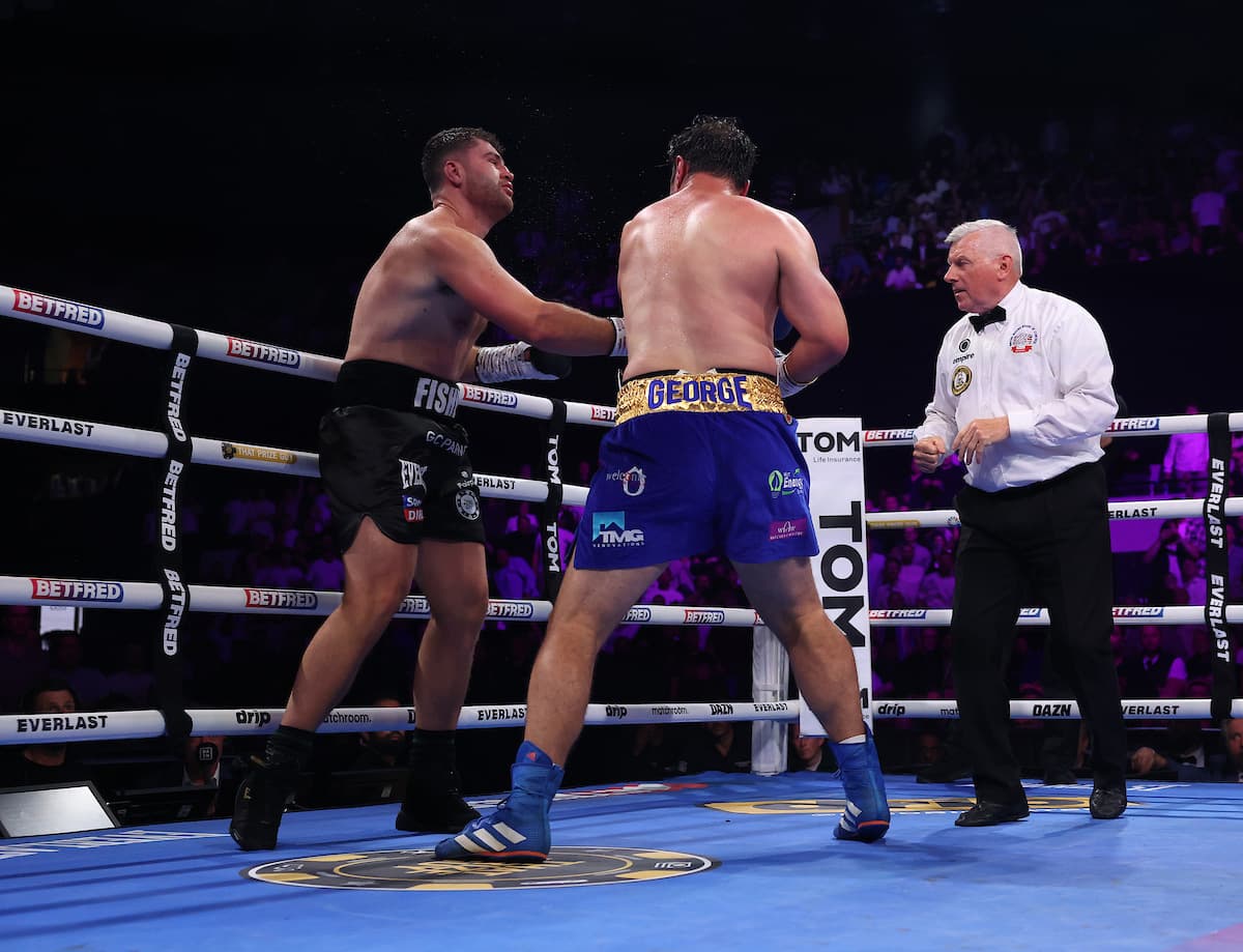 David Allen punches Johnny Fisher during their boxing rematch in London