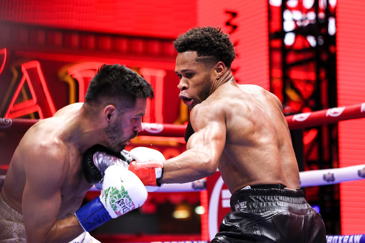 Devin Haney punches Jose Ramirez during their bout