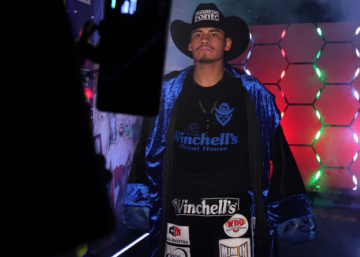 Emanuel Navarrete makes his ring walk during his boxing bout against Charly Suarez
