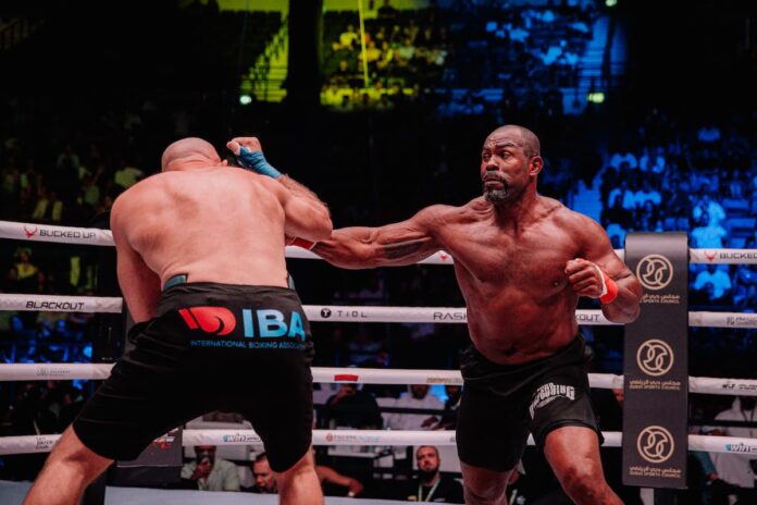 Geronimo Dos Santos punches Aleksei Oleinik during their bare-knuckle boxing bout at BKFC 71 in Dubai