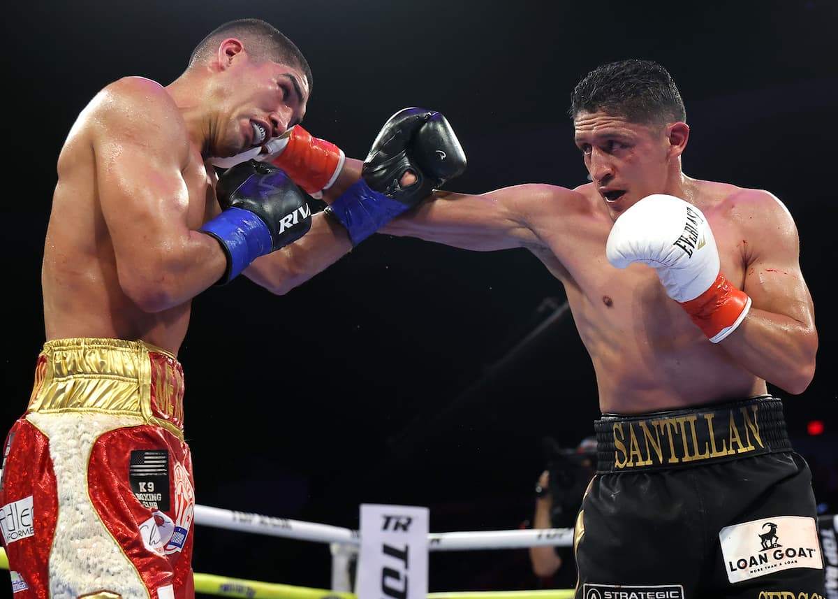 Giovani Santillan punches Angel Beltran during their boxing bout at Pechanga Arena San Diego