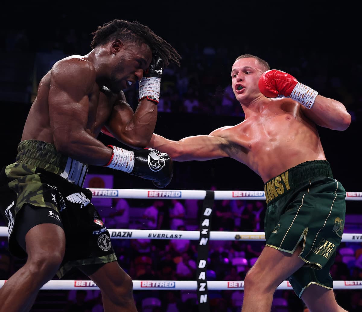 Jimmy Sains punches Gideon Onyenani during their boxing bout in London