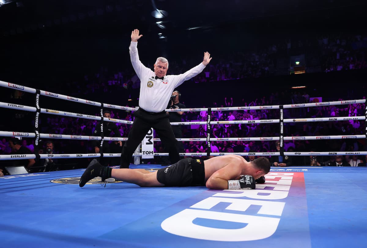 Johnny Fisher suffers a knockdown during his boxing bout against David Allen in London