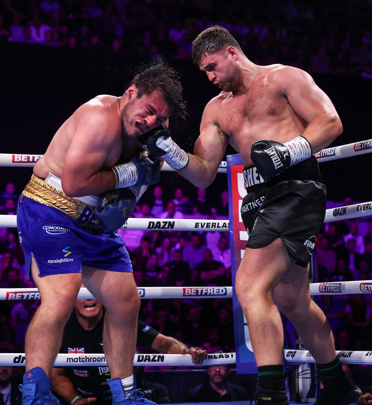 Johnny Fisher punches David Allen during their boxing rematch in London