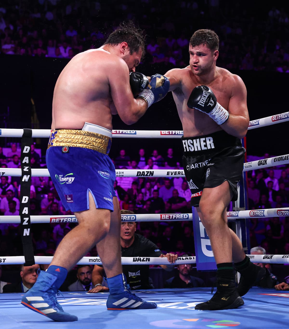 Johnny Fisher punches David Allen during their boxing rematch in London
