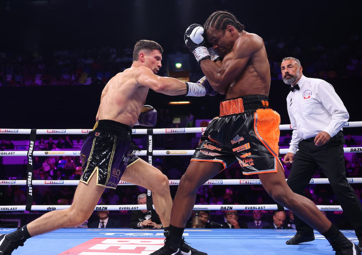 Kieron Conway punches Gerome Warburton during their boxing bout in London