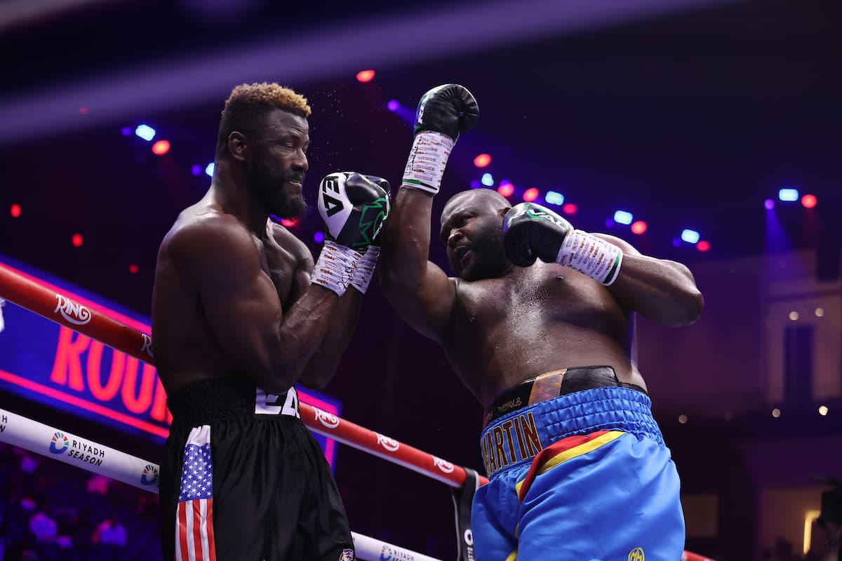 Martin Bakole throws an uppercut during his bout against Efe Ajagba