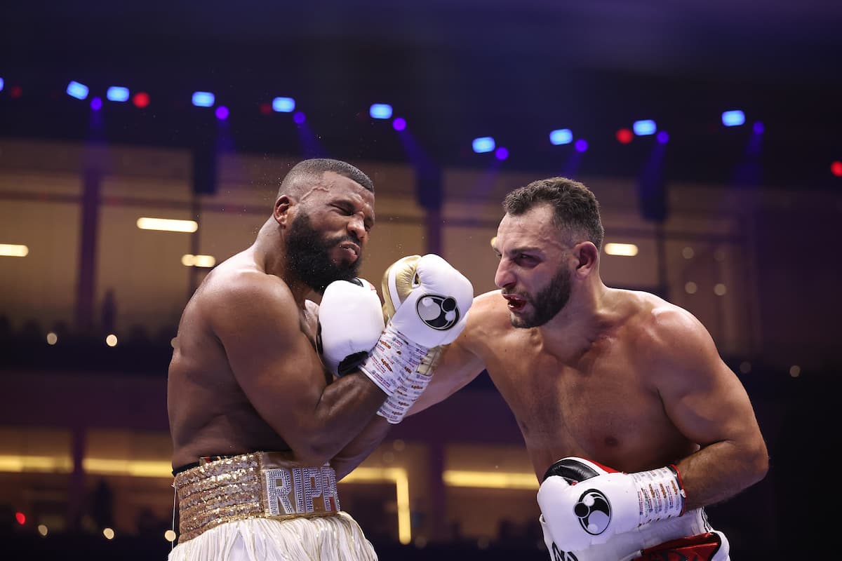 Noel Mikaelian punches Badou Jack during their bout
