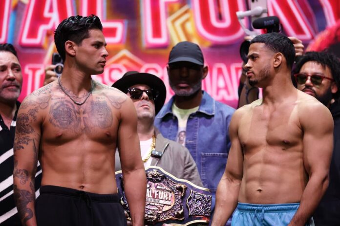 Ryan Garcia and Rolando Romero face each other at the weigh-in, ahead of their boxing bout at Times Square in New York City