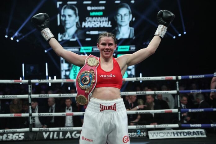 Savannah Marshall poses with her championship belt after defeating Femke Hermans in Newcastle