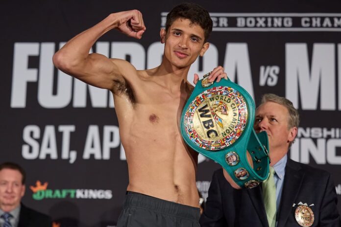 Sebastian Fundora posing with his WBC championship belt during the weigh-in ahead of his boxing match