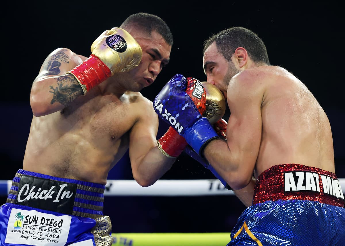 Sebastian Hernandez punches Azat Hovhannisyan during their boxing bout at Pechanga Arena San Diego