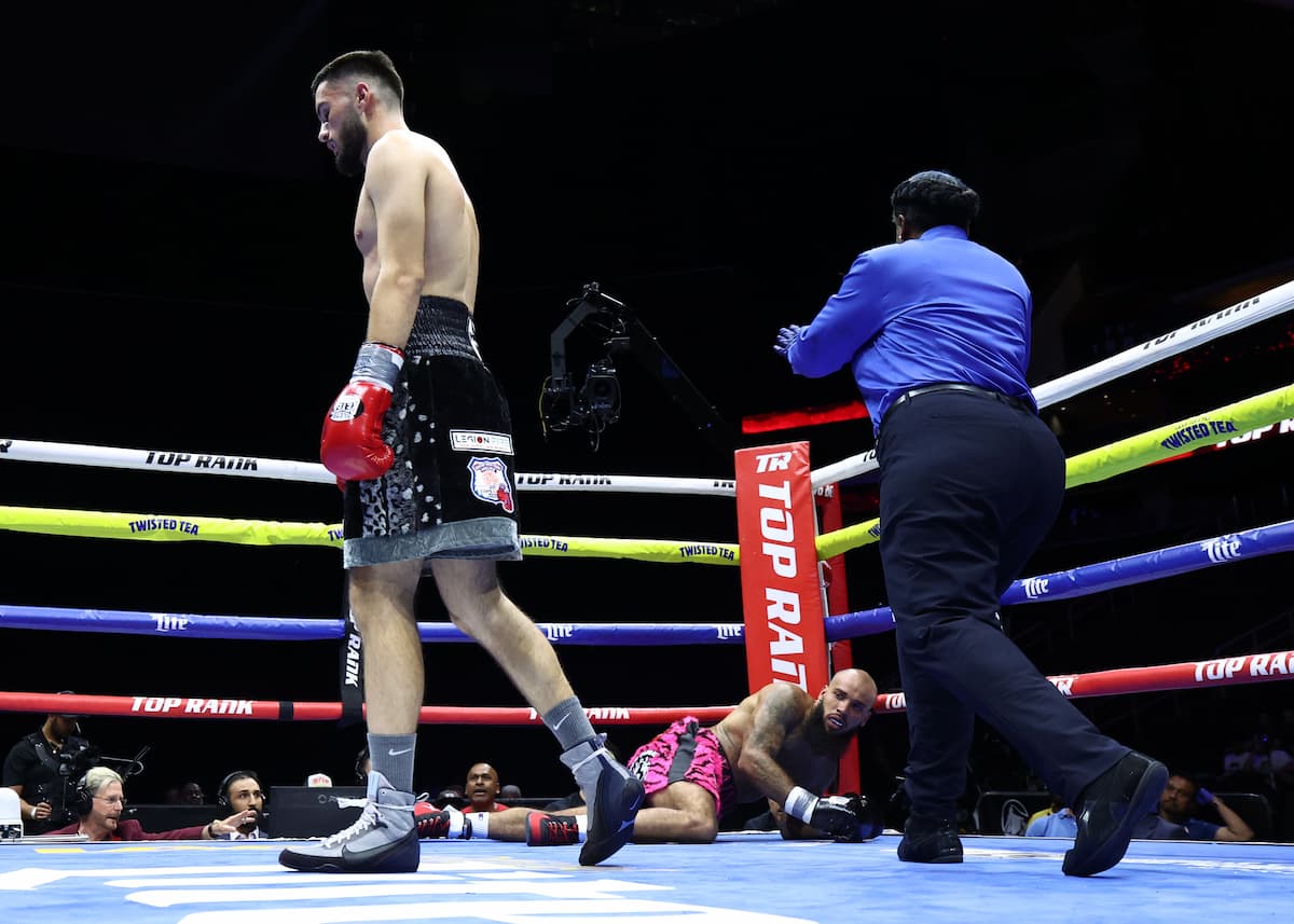 Arjan Iseni drops Kaine Tomlinson Jr. during their boxing bout in Newark, New Jersey