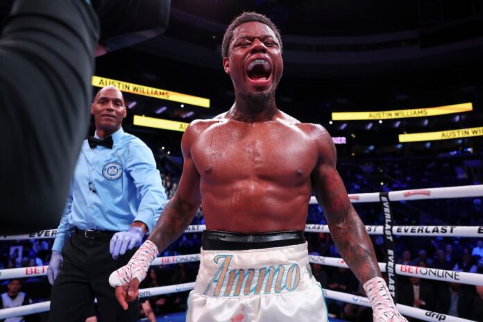 Austin Williams celebrates his victory in a boxing match
